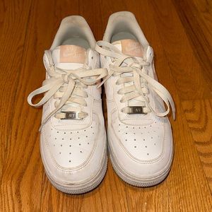 Air Forces with pink swoosh